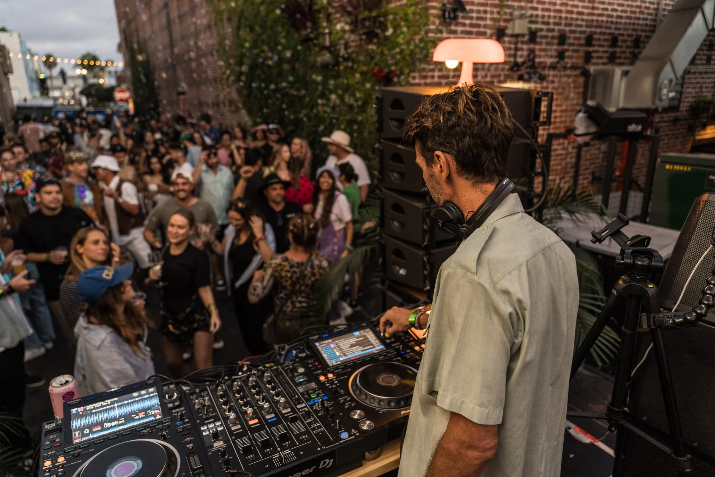 DJ set at Coco Cabana with crowd on the rooftop